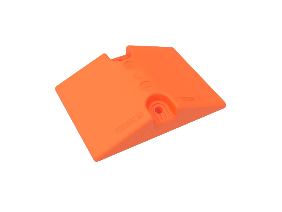 Pipe Chock S72, the lower-profile in-between chock, in high-visibility orange.